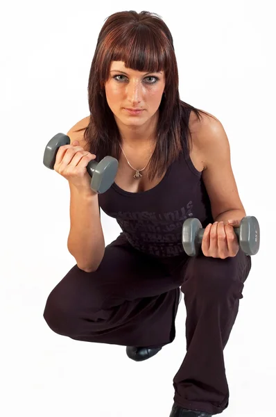 Woman lifting weights — Stock Photo, Image