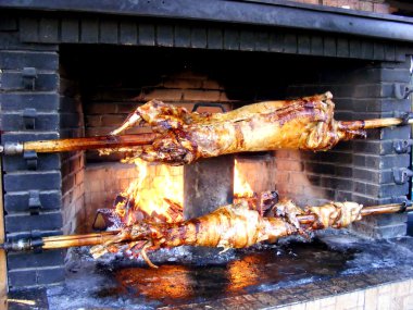 Roast lamb by fire clipart