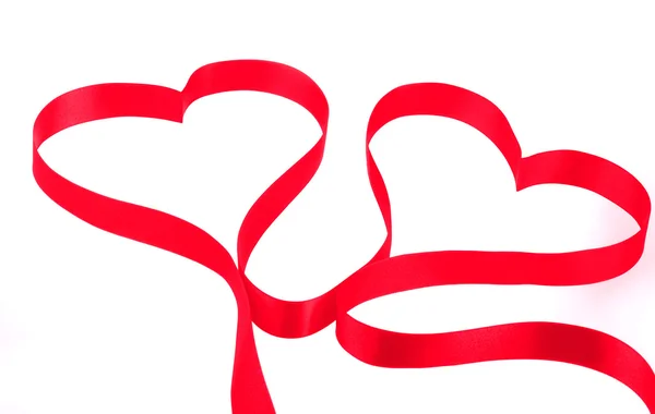 Two hearts from red ribbon — Stock Photo, Image