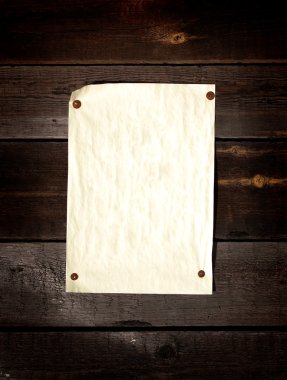 Old paper tacked to a wood wall clipart