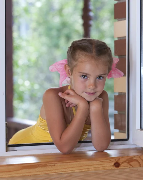 stock image A girl in the window.