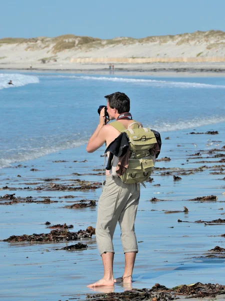 Photographe au bord de l'eau — Stockfoto