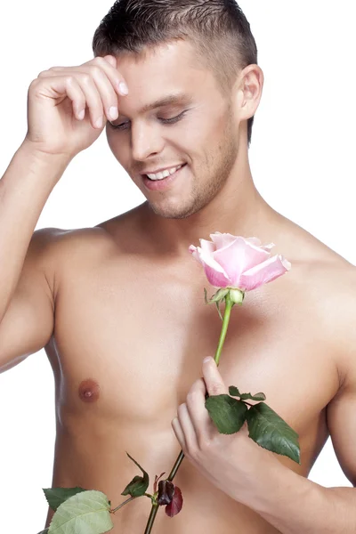 粉红玫瑰的男人 — 图库照片