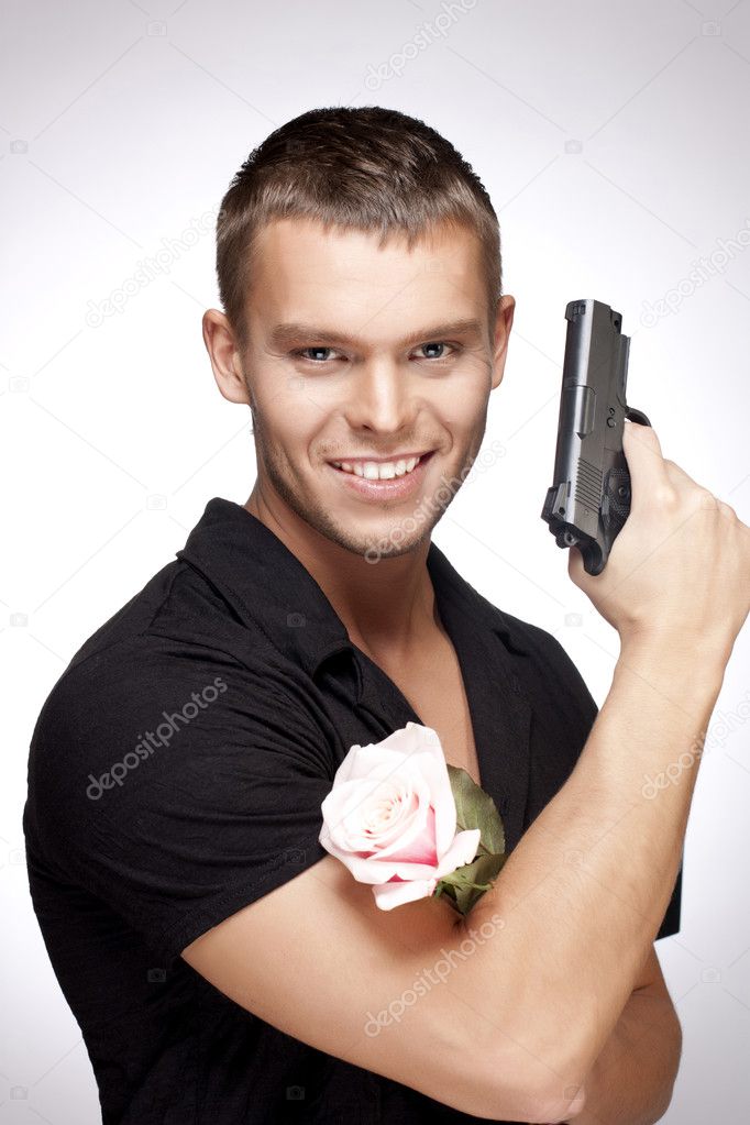 Man With Pink Rose And Gun — Stock Photo © Boroboro #2921196