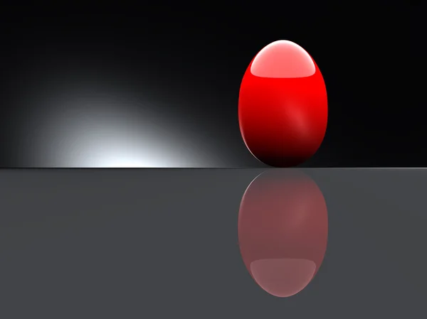 Lesklé červené vejce na černém pozadí. — Stock fotografie