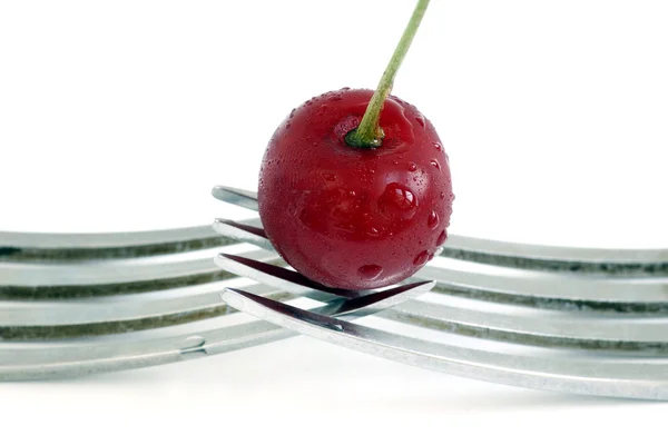 Wet cherry with two fork over white background — Stock Photo, Image