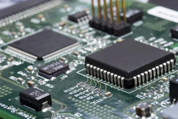 Close-up on a microchip on a scheme background — Stock Photo, Image