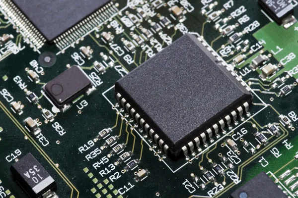 Close-up on a microchip on a scheme background — Stock Photo, Image