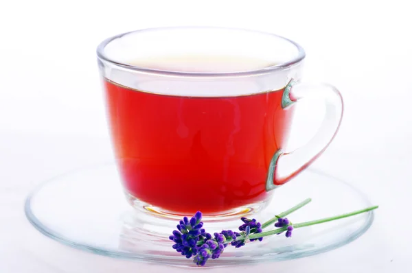 Cup of herbal tea with flowers isolated on white — Stock Photo, Image