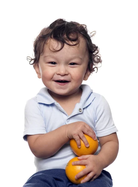The child with oranges. — Stock Photo, Image