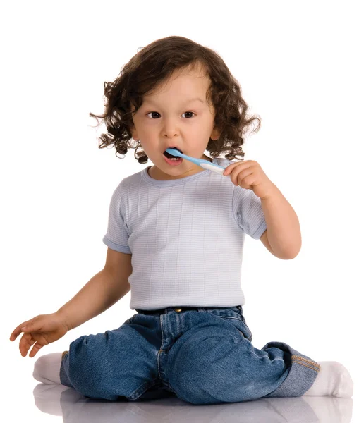 Criança com escova de dentes — Fotografia de Stock