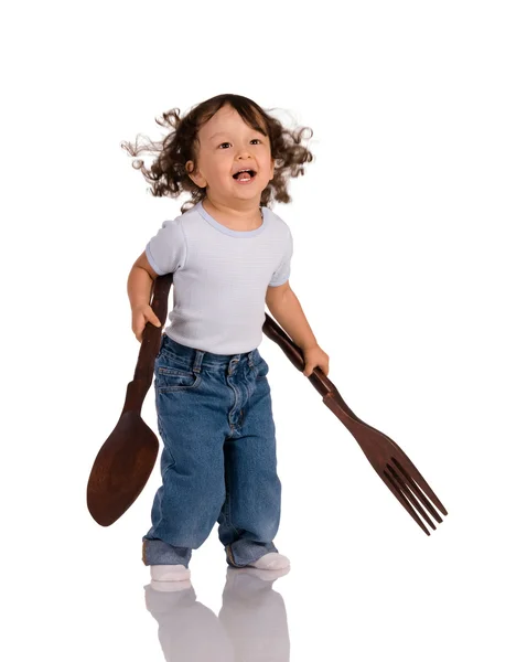 Bambino con cucchiaio grande e forchetta — Foto Stock