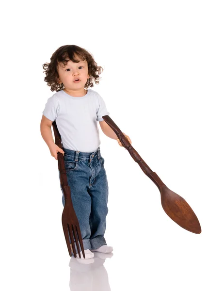 Bambino con cucchiaio grande e forchetta — Foto Stock