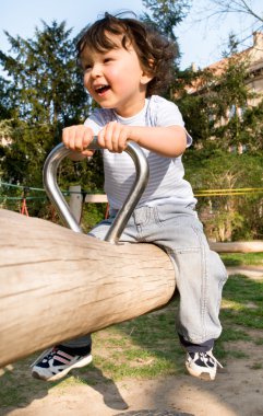 Little boy on a playground. clipart
