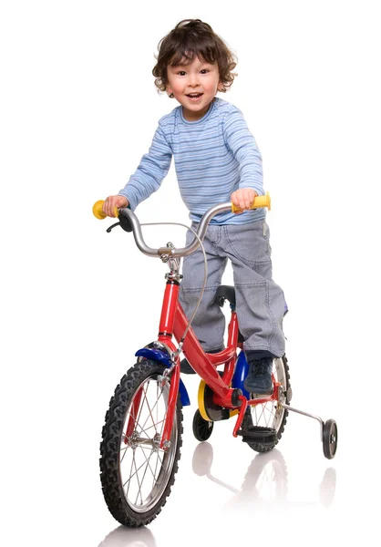 小骑自行车的人. 免版税图库图片