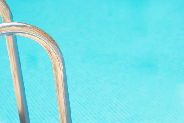 Pool abstract, ladder railings and copy space on the water — Stock Photo, Image
