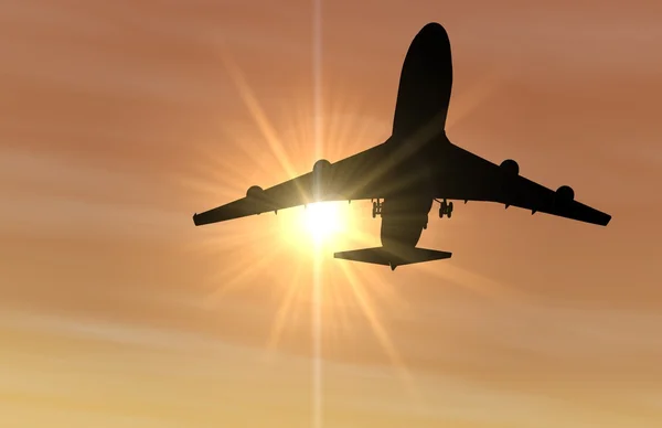 Napnyugtakor leszálló repülőgép — Stock Fotó