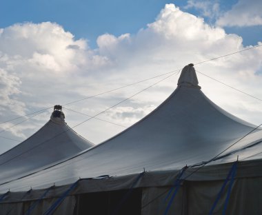 Circus Tents with Cumulus Clouds clipart