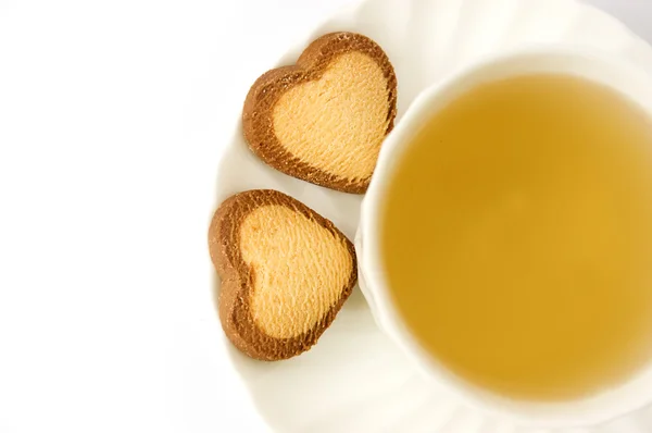 Zöld tea és keksz szív alakú — Stock Fotó