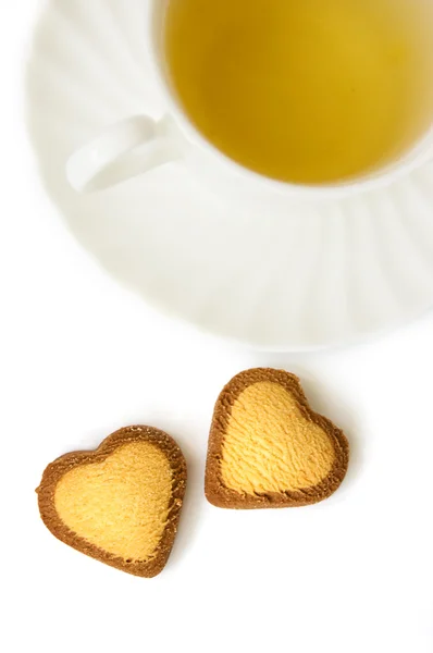 Green tea and heart shaped biscuits — Stock Photo, Image