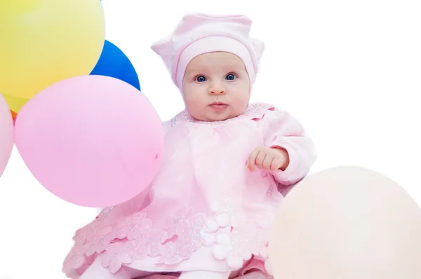 Baby flicka i rosa med ballonger — Stockfoto