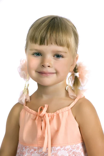 Portrait of cute girl with pigtails and cream ribbons — Stock Photo, Image
