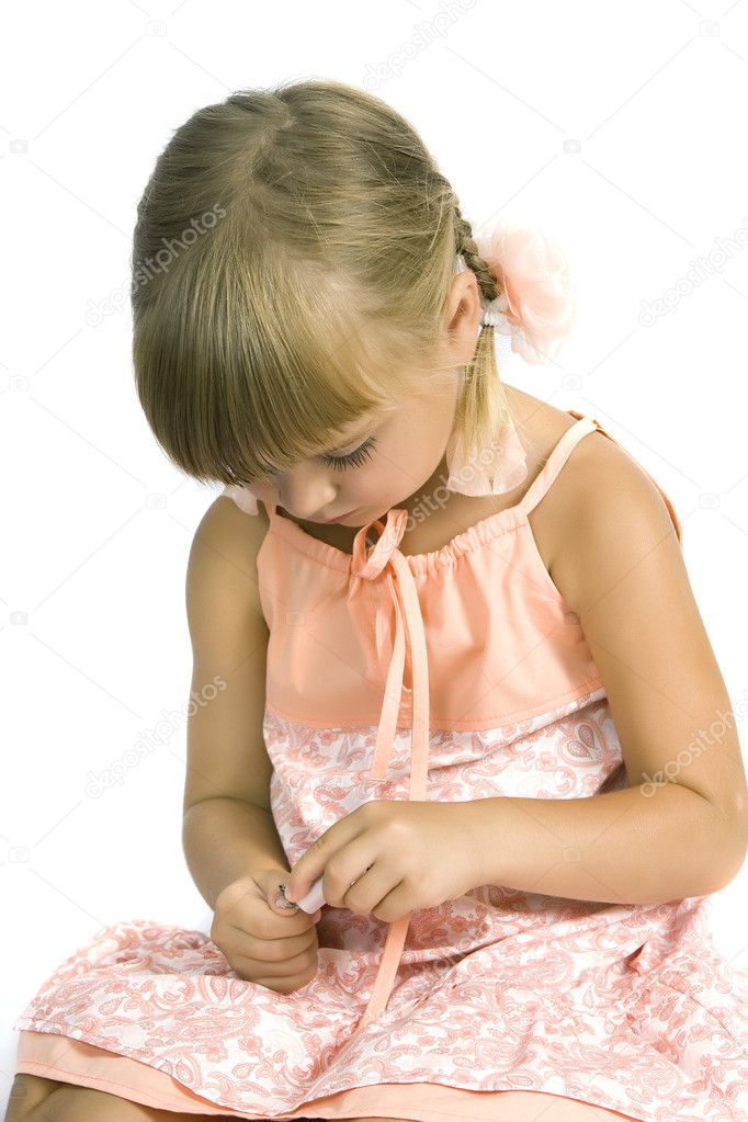 Cute little girl paints the nails