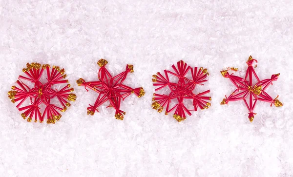 Red stars on snow — Stock Photo, Image