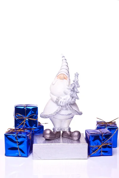 Weihnachtsmann mit Geschenken auf weißem Grund — Stockfoto