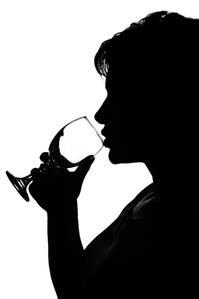 Silhouette of a woman with glass — Stock Photo, Image
