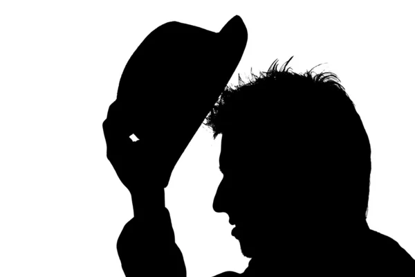 Hombre poniéndose un sombrero en la cabeza — Foto de Stock