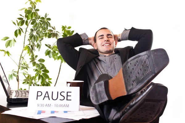 Businessman relaxing in office — Stock Photo, Image