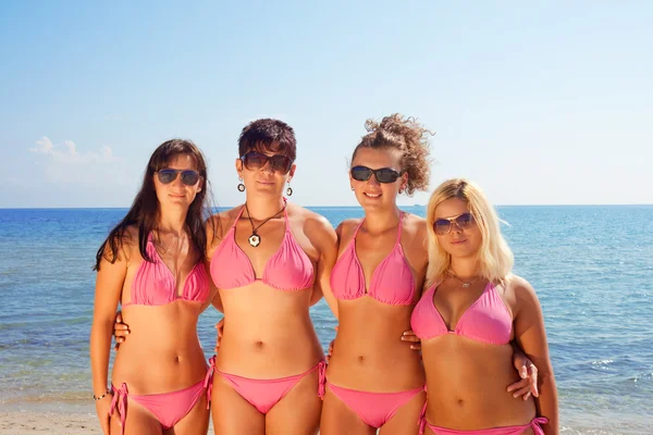 Young girls in bikinis on beach Royalty Free Stock Images