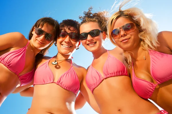 Females in bikinis on the beach Royaltyfria Stockfoton
