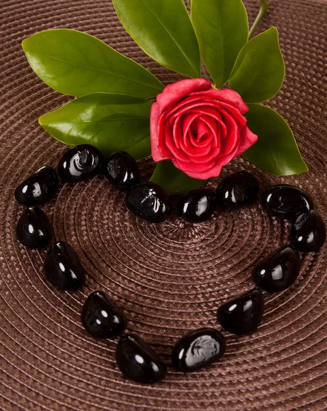 Black stones in heart shape — Stock Photo, Image