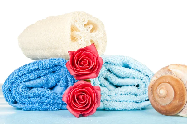 Handdukar och rosor — Stockfoto