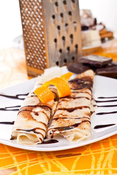 Sweet pancakes with orange peel — Stock Photo, Image