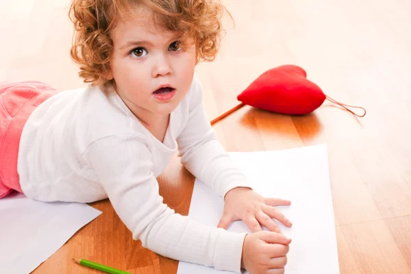 Little girl drawing on the floor — Stock Photo, Image