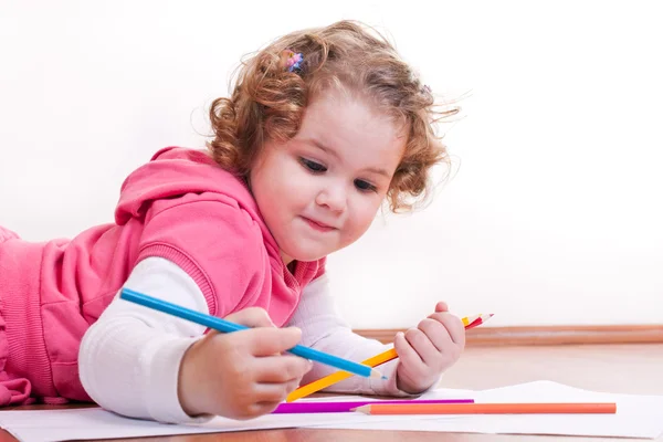 Adorable girl is drawing — Stock Photo, Image