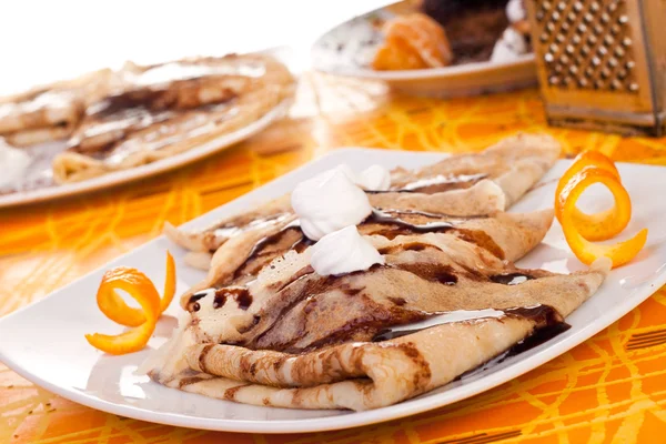 Pancakes decorated with orange peel — Stock Photo, Image
