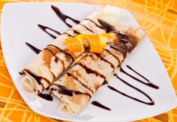 Decorated pancakes with orange — Stock Photo, Image