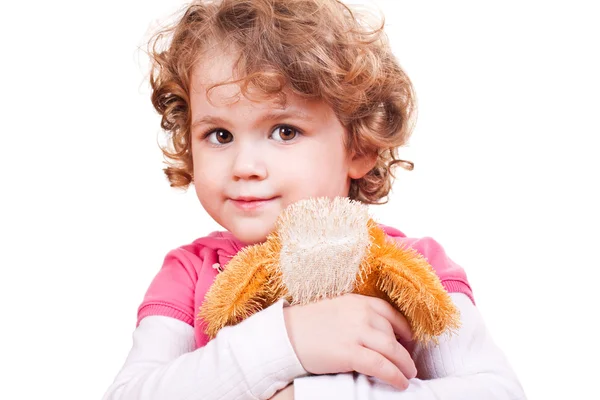 Little girl hugging toy dog — Stock Photo, Image
