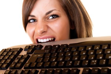 Businesswoman get angry on her keyboard clipart