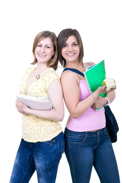 Two students with books and apple — Stock Photo, Image