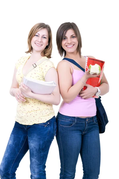 Female students with books and apple — Stock Photo, Image