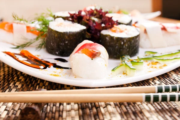 Decorated delicious sushi on table — Stock Photo, Image