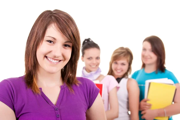 Lächelnde Studentin und ihre Freunde — Stockfoto