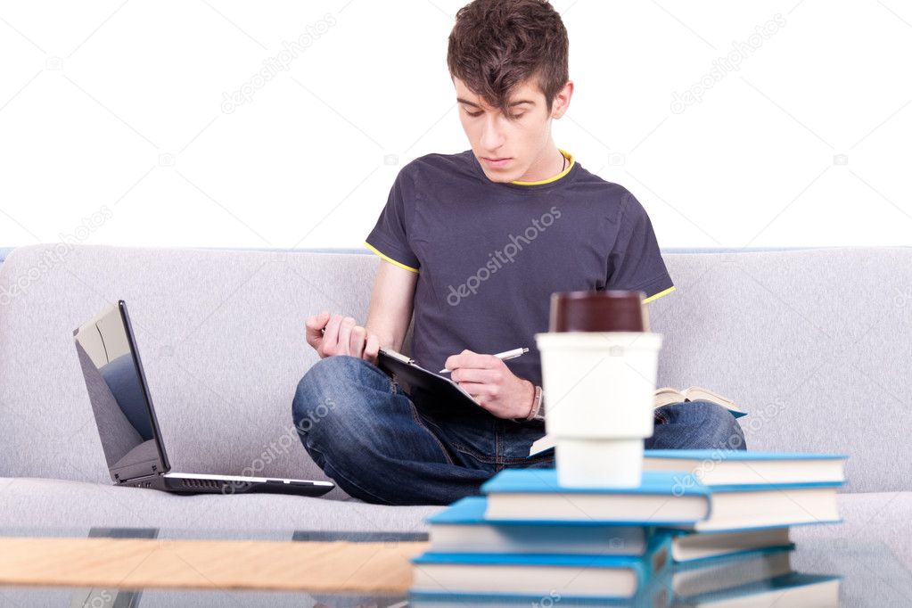 Male teenager studying