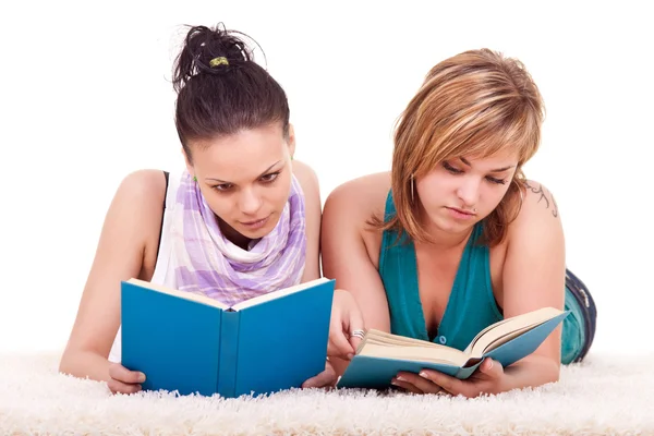 Two young girls reading books — Stock Photo, Image