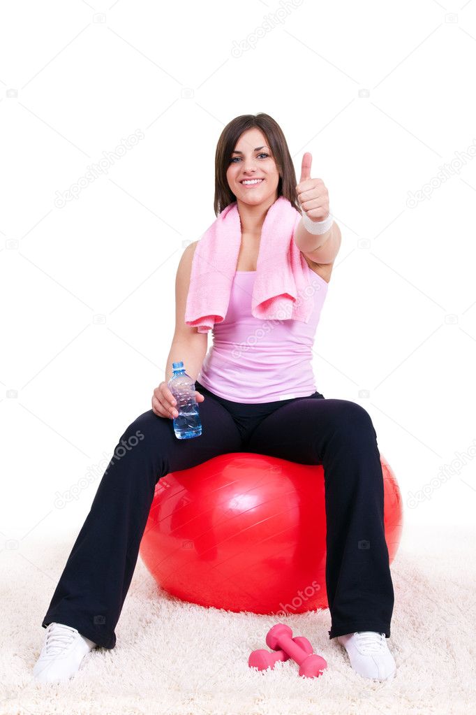 Girl sitting on a fitness ball